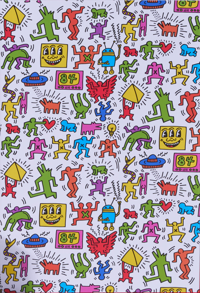 A Keith Haring Design with a white background and colorful figures filling the space. 