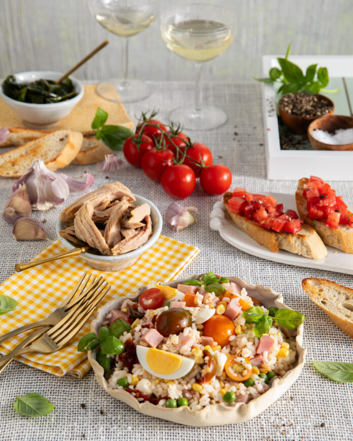 A table setting of Italian rice salad and Bruschetta