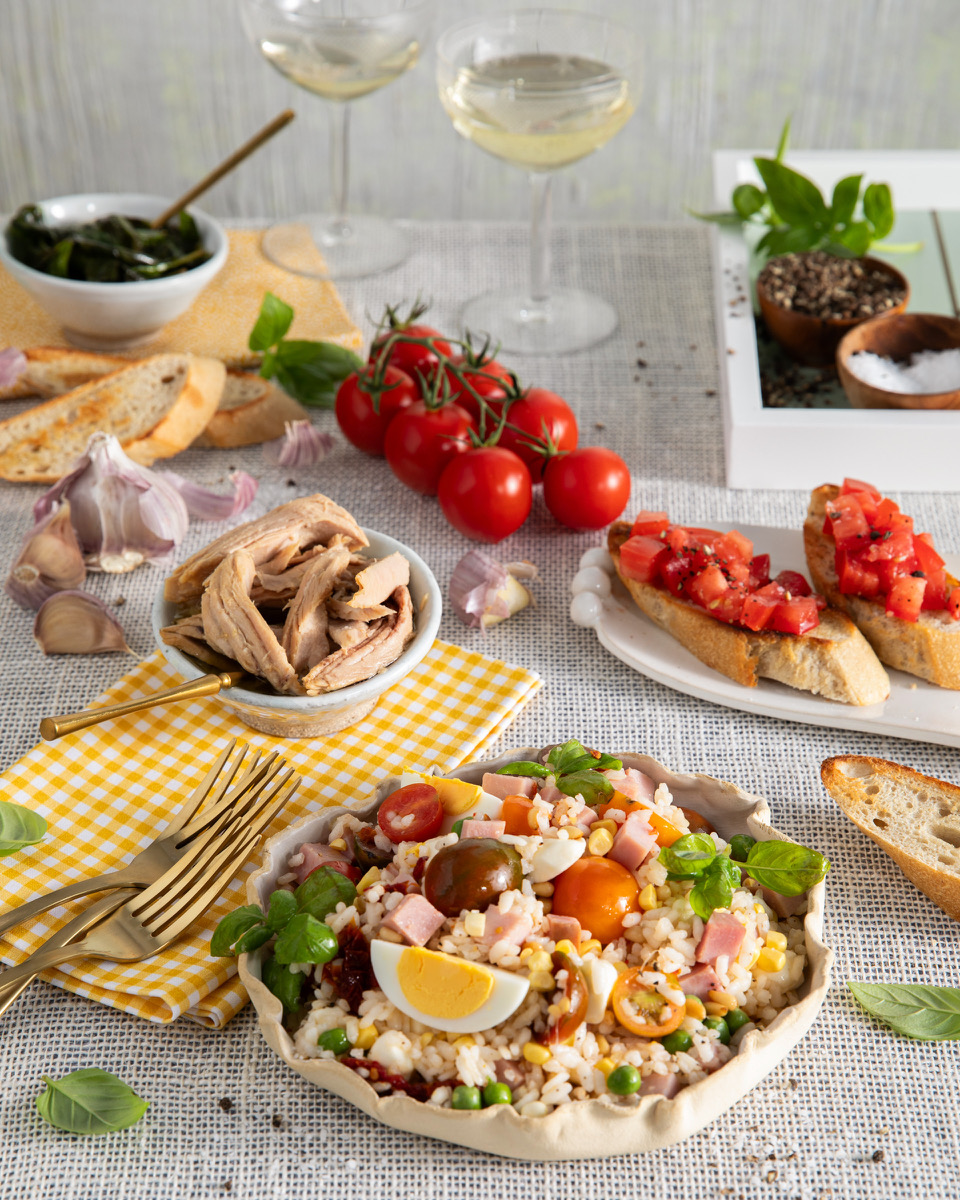 A table setting of Italian rice salad and Bruschetta