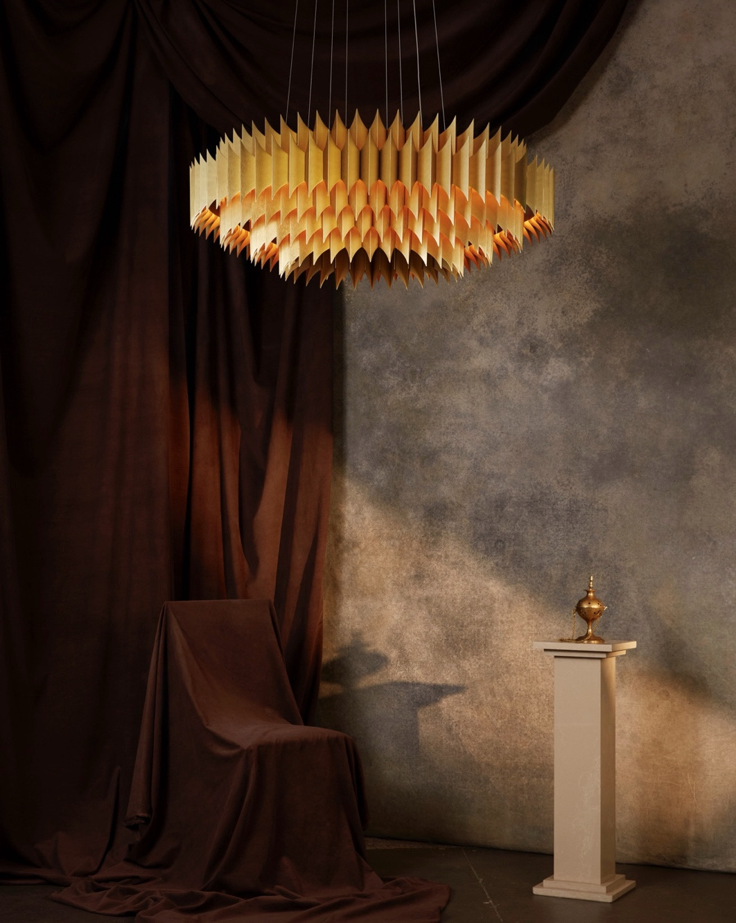 One of Lee Broom's designs, KING, with a majestic lamp and a smaller pedestal.