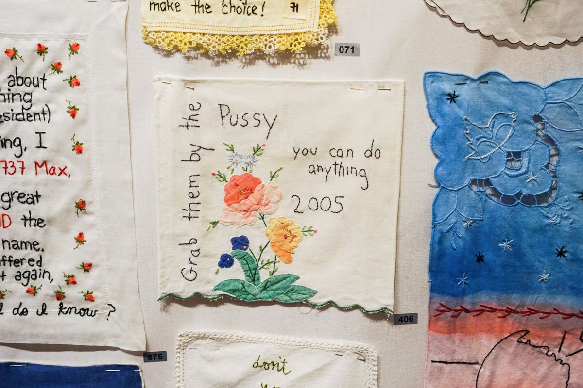 Diana Weymar's embroidery of Donald Trump's words on a white wall