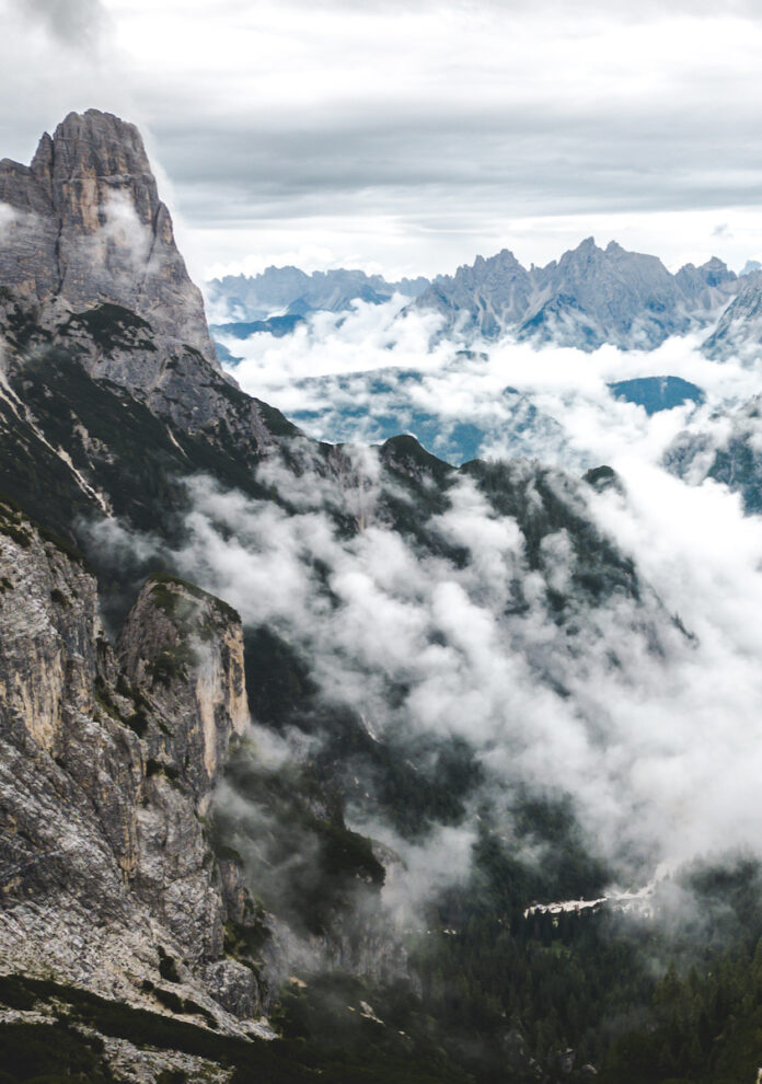 The Dolomites, in a beautiful foggy mountain range between Italy and Austria