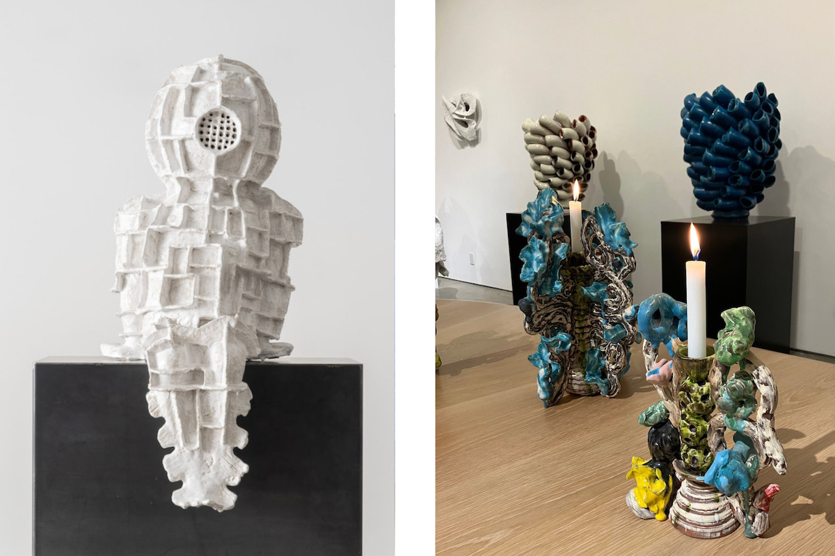 Two scuptures, one white and one a multicolored structure with candles