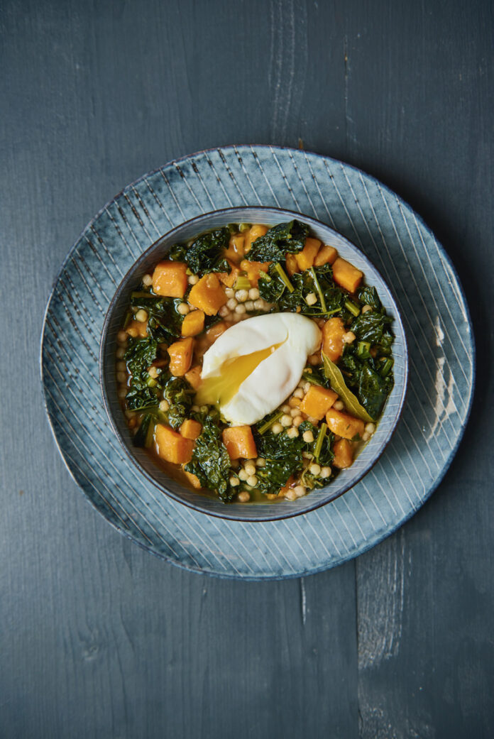Kale and Sweet Potato Soup A plate of kale and sweet potato soup with a poached egg