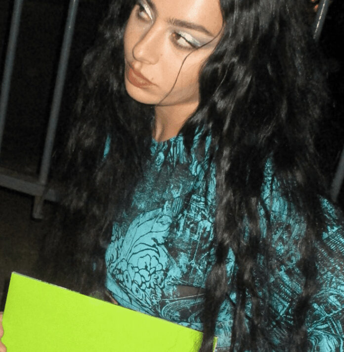 Charli XCX poses with the 