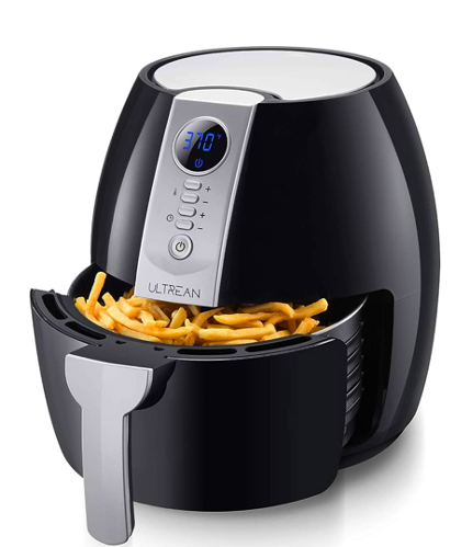 An air fryer with fries cooking in it, set to 370 degrees 