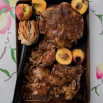 A peach pulled pork summer BBQ recipe styled on a white background