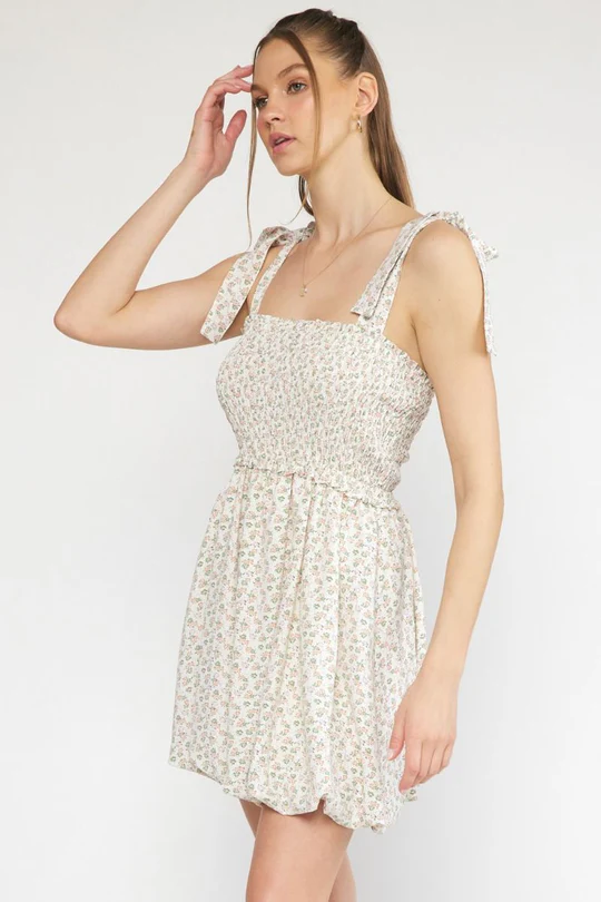 A woman in a white sundress on a white background