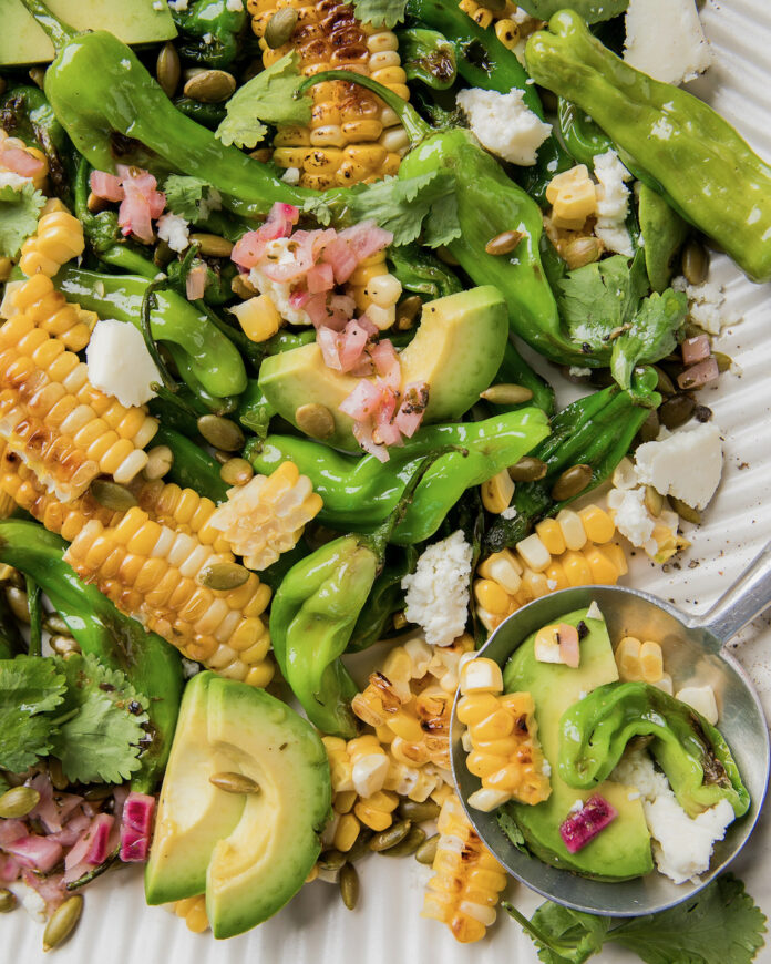A shishito pepper corn salad in a bowl.