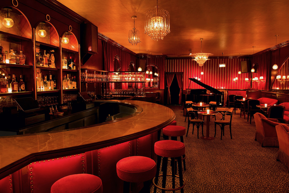 The interior of The Nines, a romantic bar lit in red