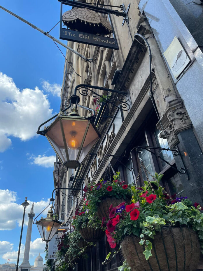 The facade of a London pub in summertime