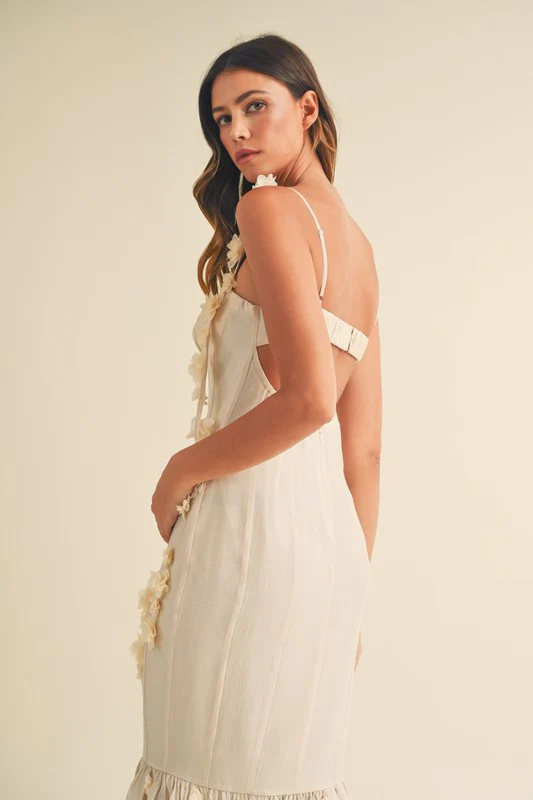 A woman in a white dress on a white background