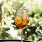 A summer spritz on a forested background on a sunny day