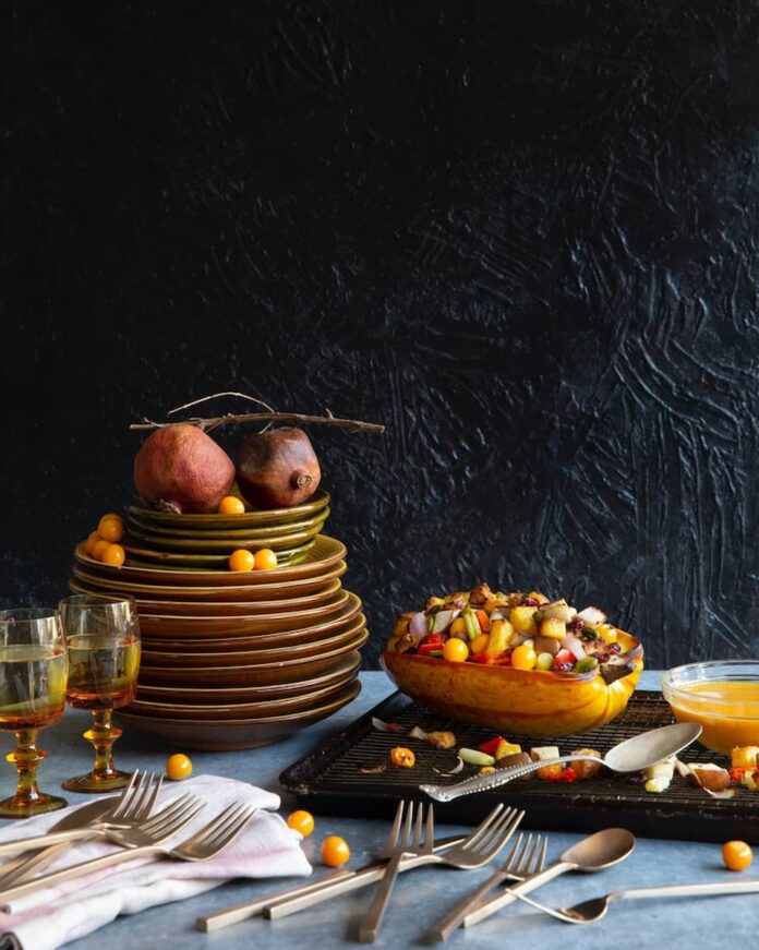 A hearty and flavorful dish featuring roasted winter squash filled with a delicious stuffing mixture of grains, vegetables, and aromatic herbs.