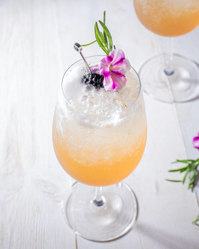 A berry spritz on a white background