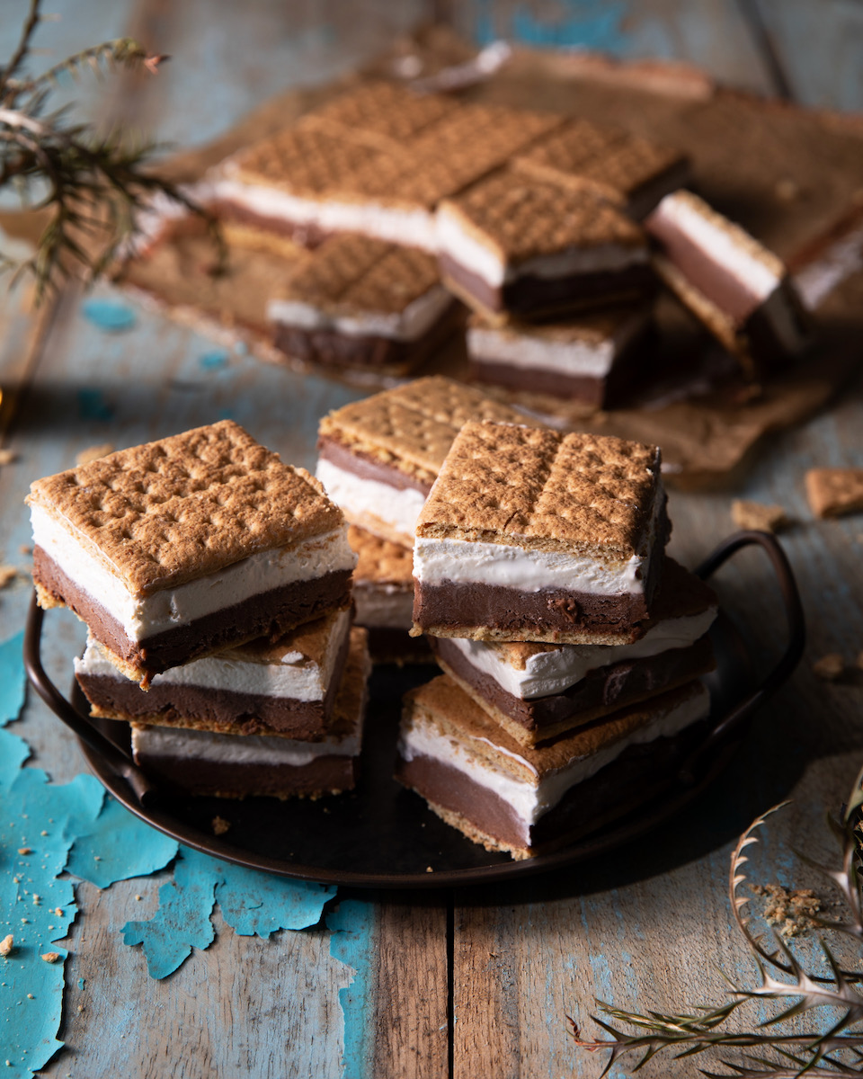 Frozen s'mores on a blue and brown background, a Labor Day dessert recipe