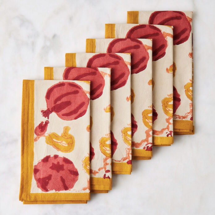 A set of napkins with pomegranates on them