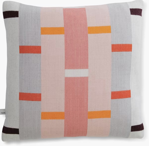 A grey, white, and red pillow with stripes 