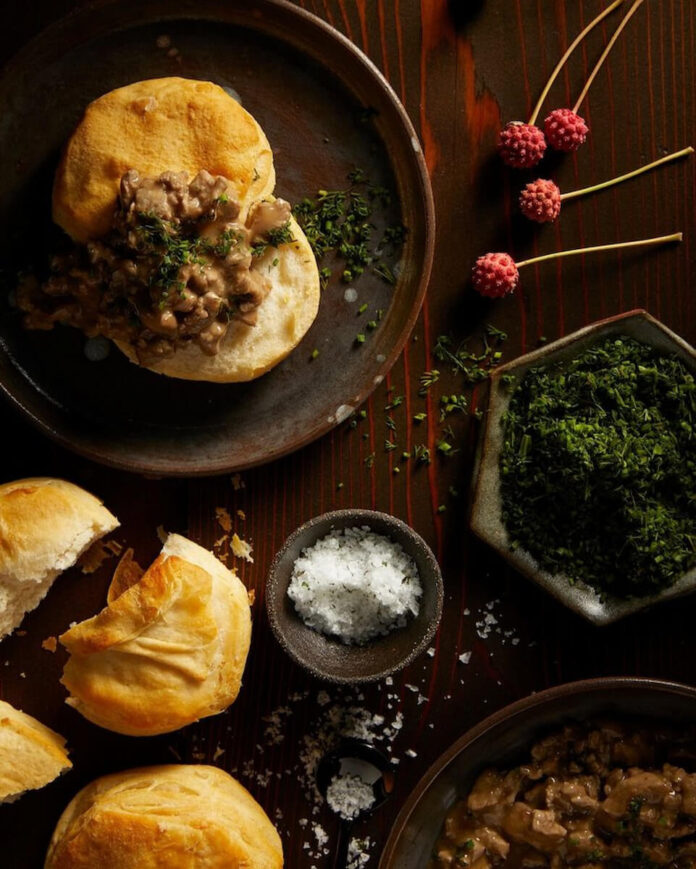 A comforting and savory dish featuring homemade flaky biscuits smothered in a rich and flavorful turkey sausage gravy, offering a hearty and satisfying breakfast or brunch option.