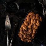 A Halloween-themed coffee cake on a black background.