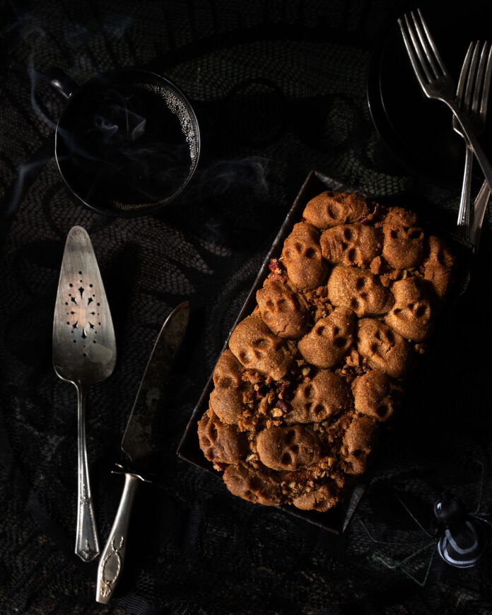 A Halloween-themed coffee cake on a black background.
