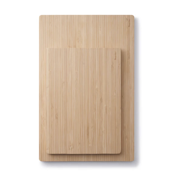 A bamboo cutting board on a white background