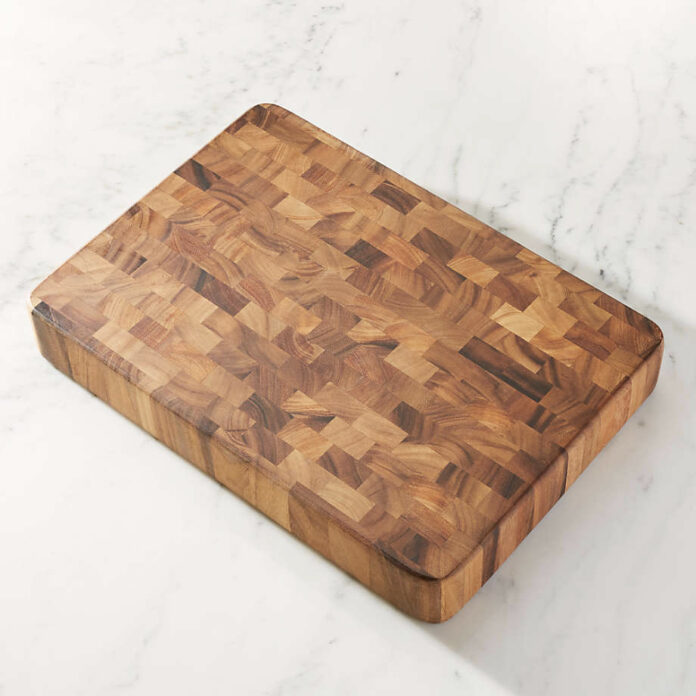 A wooden cutting board on a white background