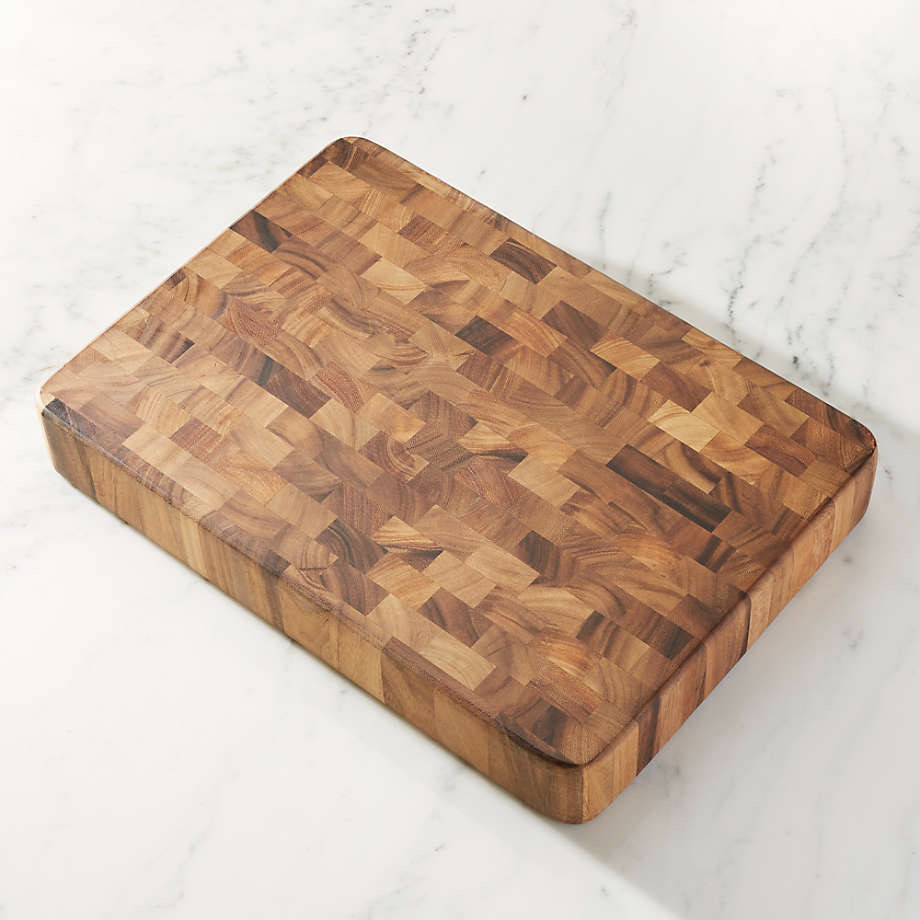 A wooden cutting board on a white background