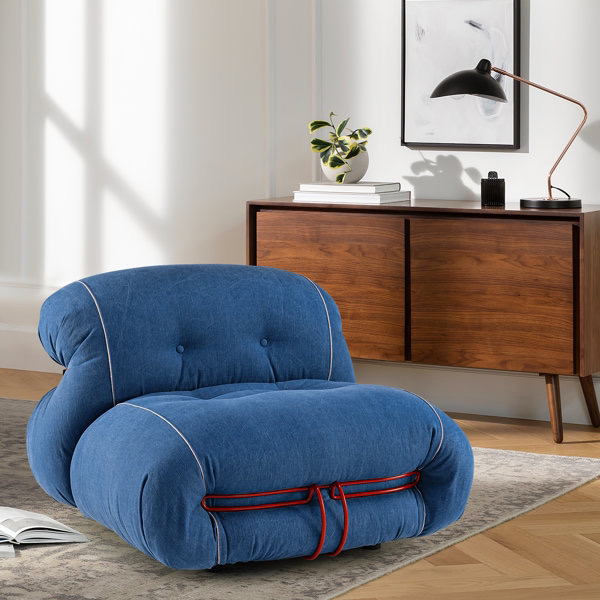 A denim bean bag lounger from Wayfair set up in a room