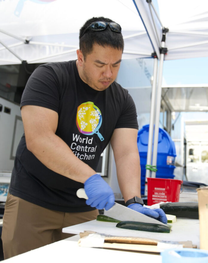 A volunteer from World Central Kitchen works on disaster relief for Hurricane Helene