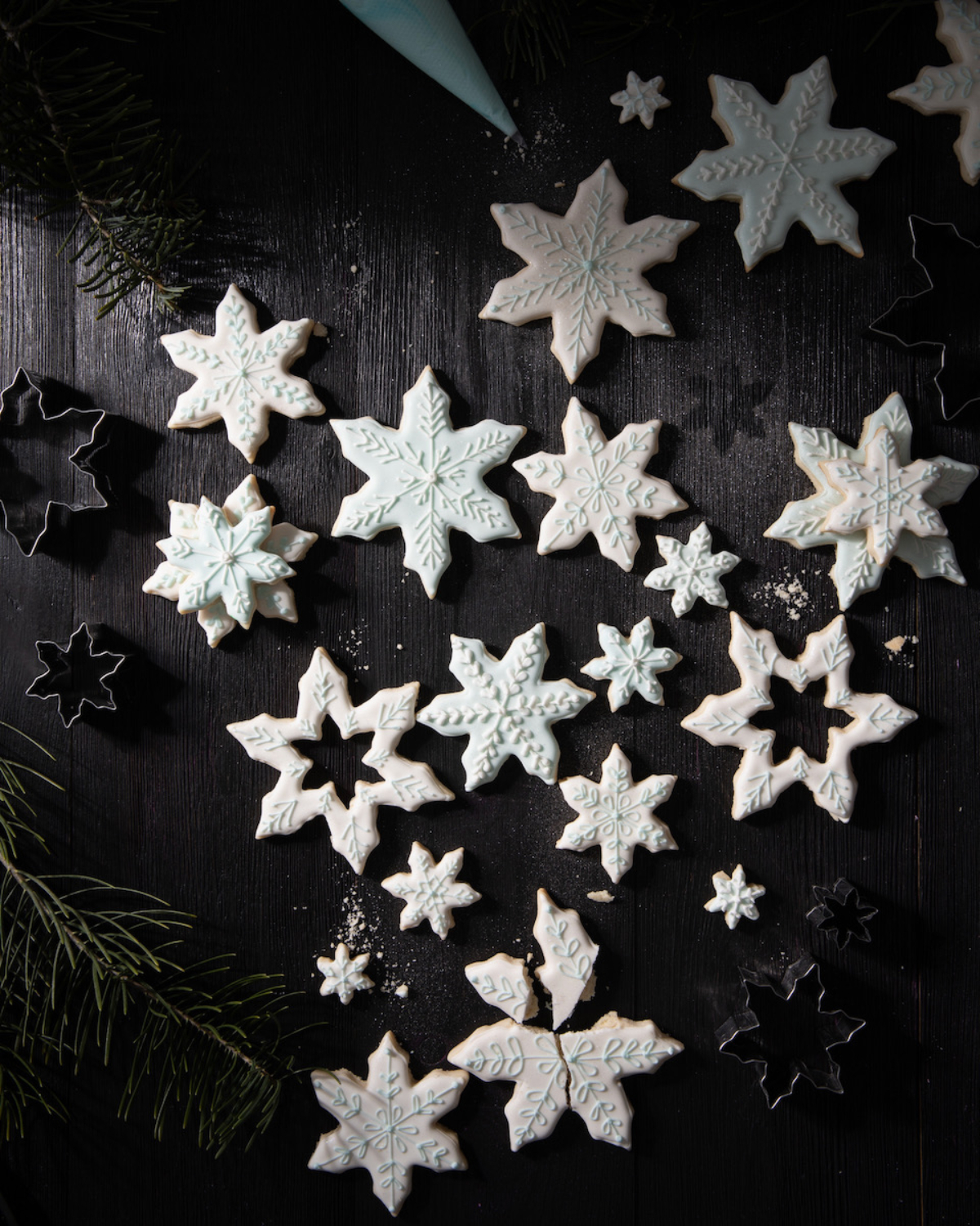 Sugar cookies shaped like snowflakes on a black background!