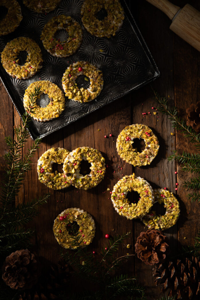 Pistachio Wreath Cookies (1) Pistachio cookies on a white background