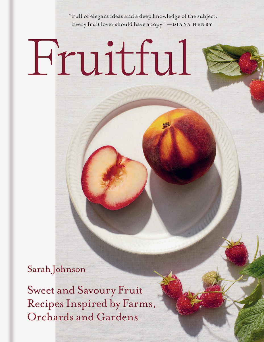 The cover of the cookbook Fruitful, which features peach on a white plate