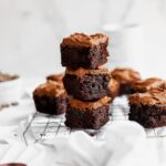 Mocha Brownies served on a steel grill, which is placed on a white piece of cloth