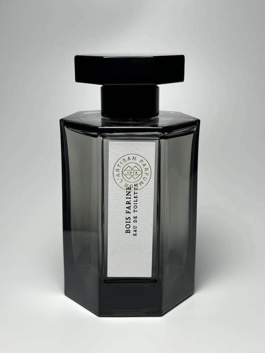 A bottle of Bois Farine, black with a rectangular top
