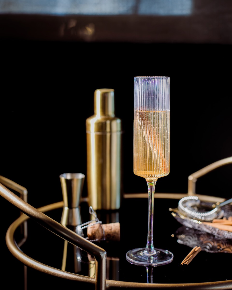 A champagne flute holds this cocktail inspired by the "Eleven Pipers Piping" verse of "The Twelve Days of Christmas"