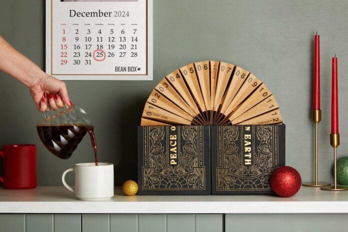 A coffee-themed advent calendar from Onyx, staged with a calendar and a pourover glas