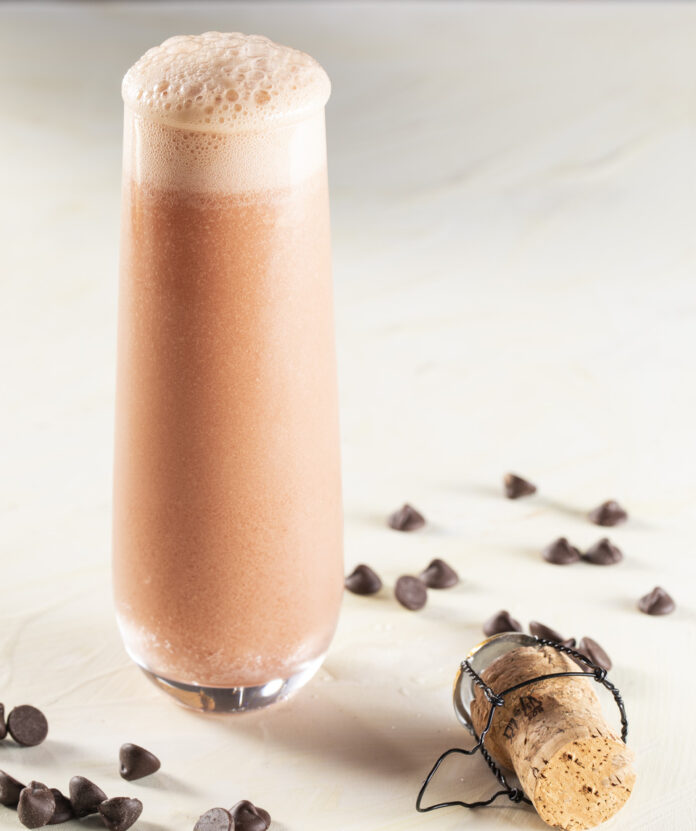 Chocolate covered Cherry a homemade high noon A tall glass filled with a creamy, chocolate-colored cherry cocktail topped with a light, foamy head.