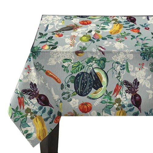 A veggie-patterned linen tablecloth on a white background