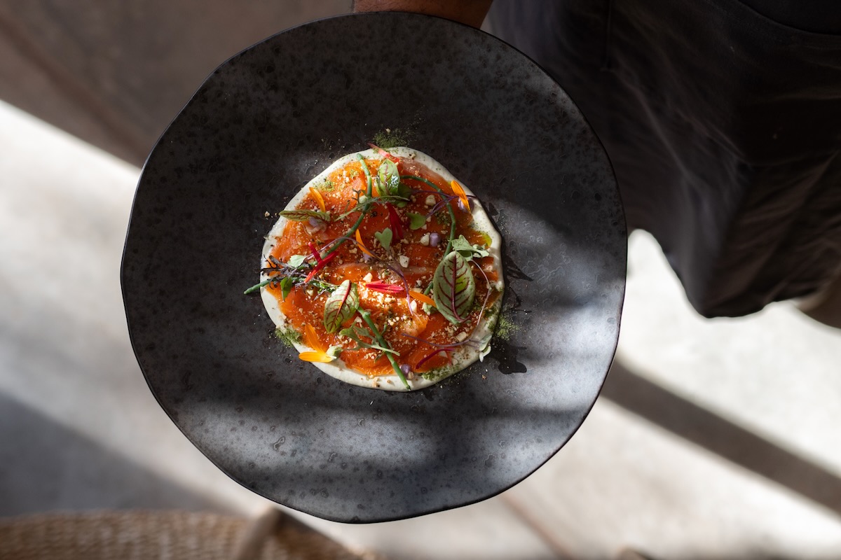 A meal in a black pot from Our Habitas in Atacama, Chile