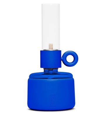 A candle-shaped lamp with a blue base from Fatboy, staged on a white4 background