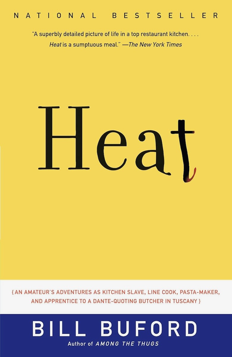 The cover of Heat by Bill Buford, a yellow book with black text on it. 