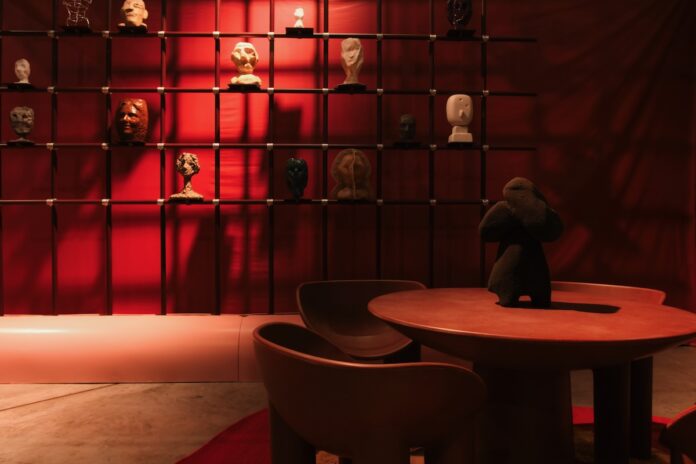 Dispatches from Paris A red, moody interior of a space at Paris design show