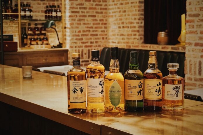 A lineup of Japanese whisky bottles at a Tokyo whisky portfolio tasting.