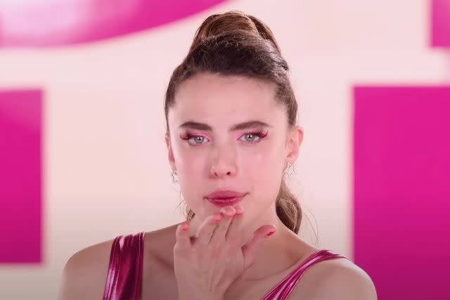 Margaret Qualley in The Substance blows a kiss at the camera.