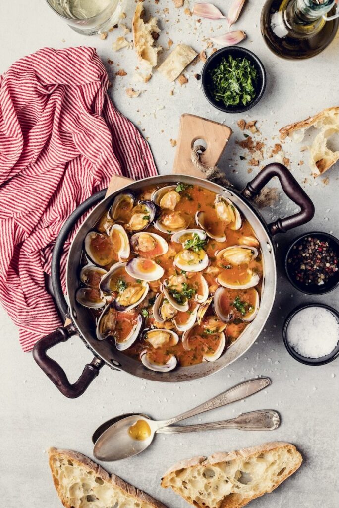 Tuscan clam soup in a pot.