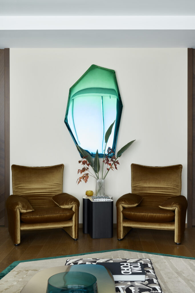 The Tafla C Mirror in an emerald/sapphire finish radiates with futuristic intensity.
