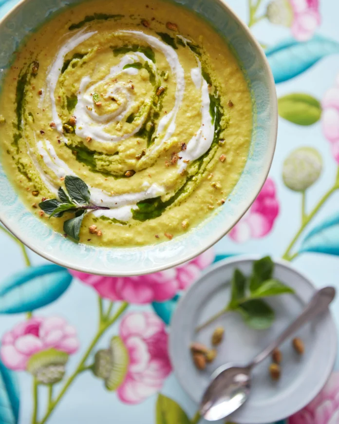 An above shot of a bowl filled with a yellow, Chilled Cauliflower Soup.