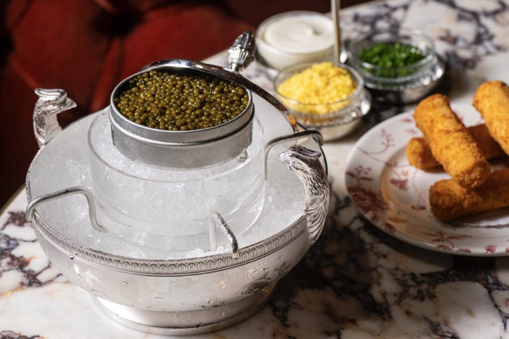 A bowl of ingredients sit on a table.