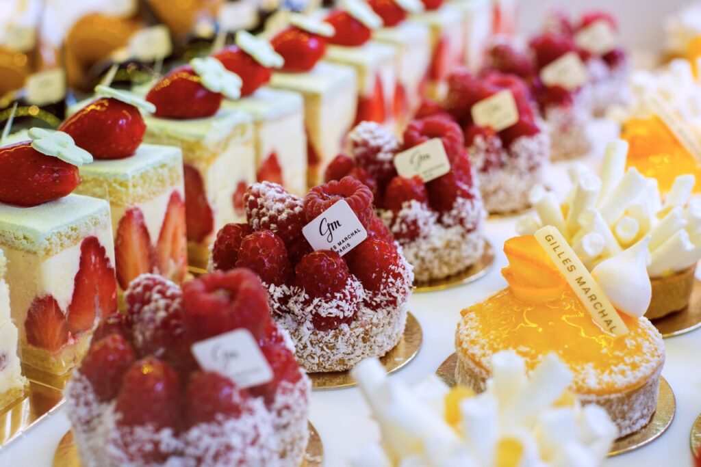 Various confections from a Paris bakery with fresh fruits on top.